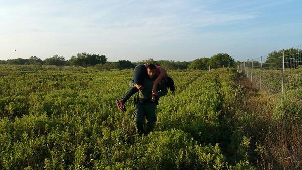 Border Patrol Agent transports abandoned female from ranchland