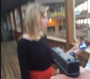 news anchor and cameraman shot