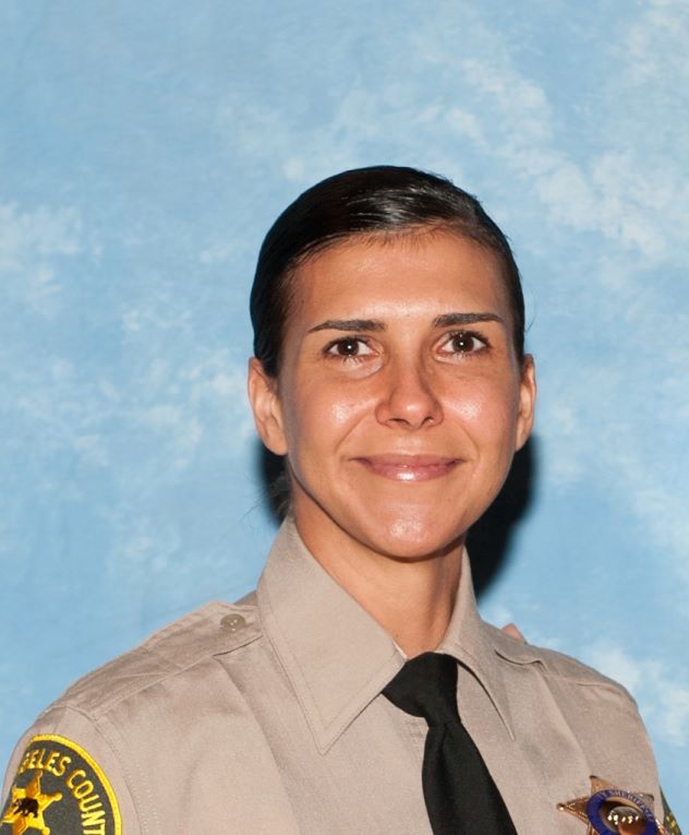 Los Angeles County Sheriff's deputies mourned on Monday the loss of a colleague and mother who was killed Sunday night by her firefighter husband who later committed suicide.