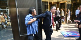 A group of protesters gathered outside Trump Tower today to demonstrate against Donald Trump‘s comments about Latinos, and a guard ended up punching one of them in the face.