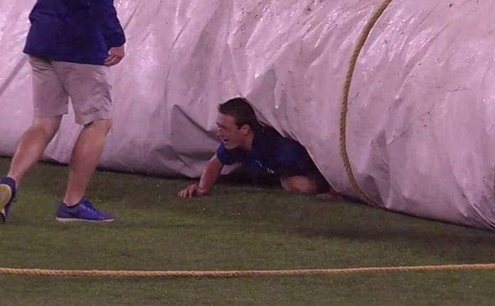 A Royals crew member gained his 15 minutes of fame while unrolling the tarp at Kauffman Stadium on Thursday.