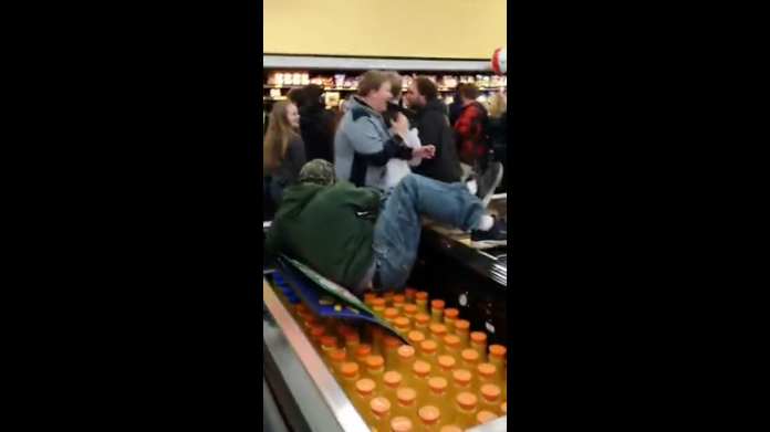 While doing some Black Friday shopping, 'Cooloops0509' managed to capture this insane footage of a young man climbing over an isle of refrigerated goods in order to get to the other side, while utter chaos ensues in the background. Looks like it's shaping up to be another hectic Black Friday this year!