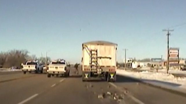NEBRASKA -- New video shows a Sheriff's Deputy jumping into a moving truck in order to stop a pursuit.