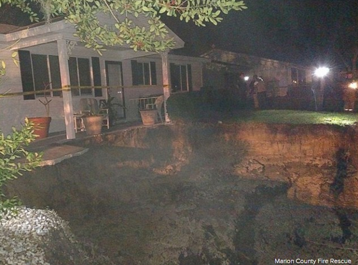 Massive 60 Foot Sinkhole Opens Up In Florida Neighborhood Prompting