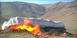 Afghan officials incinerate more than 18 tonnes of drugs confiscated in Kabul. Rough Cut (no reporter narration).