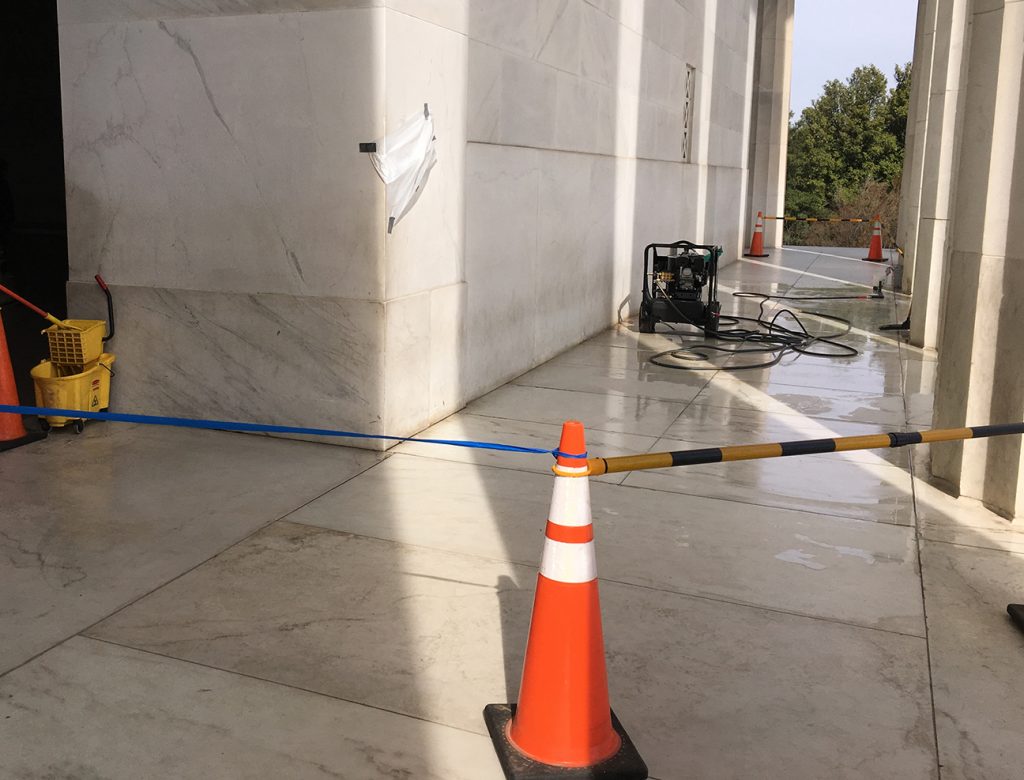 Clean up continues at the Lincoln Memorial February 21, 2017 after it was marred with graffiti. The writing is covered by the white sheet on the wall. MUST CREDIT: Photo for The Washington Post by Perry Stein.
