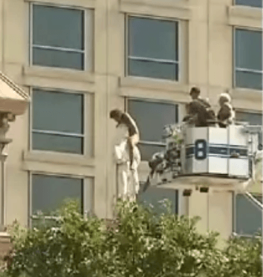 Naked Woman Climbs Atop Saint Patrick Cathedral Statue 